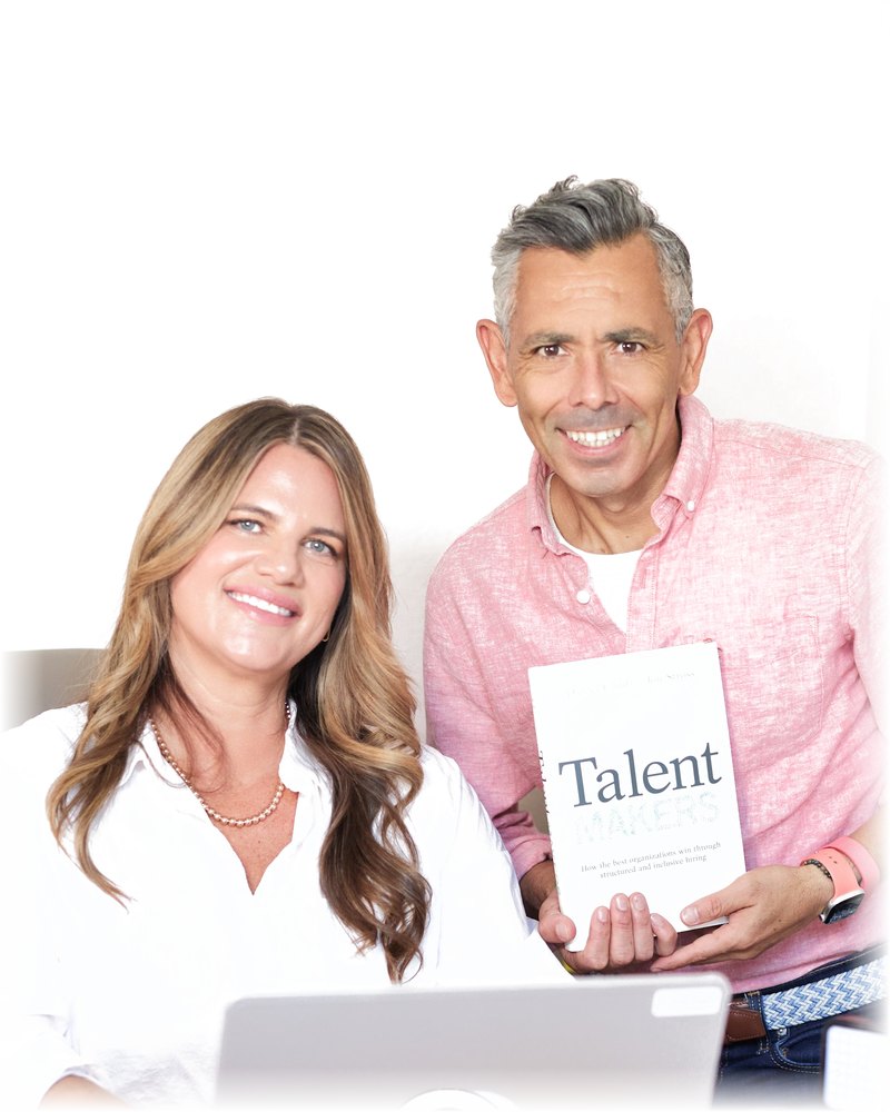 Jami Adkins and Andrés Traslaviña with the book Talent Makers